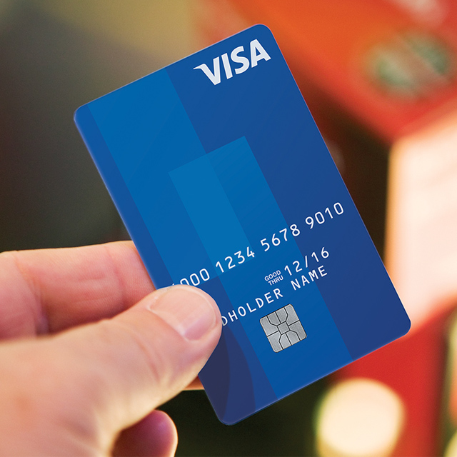 Man holding Visa card.