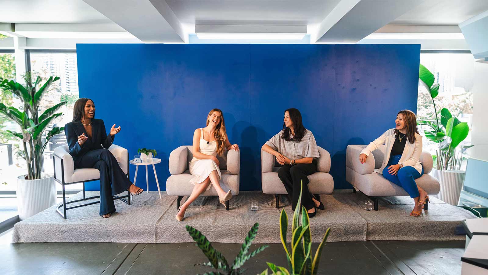 People sitting in chairs talking to each other