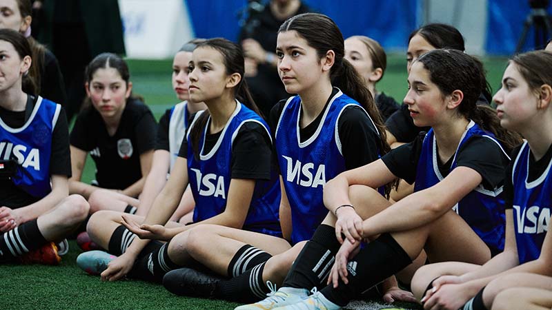 Visa Play and Stay participants with Visa logo on jerseys.