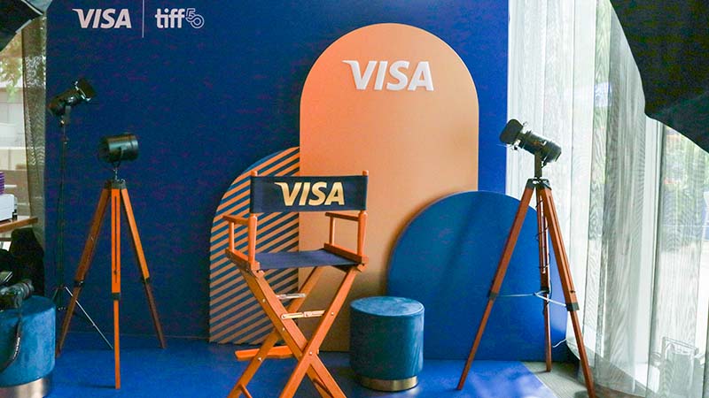 Visa-branded chair and Visa and TIFF-branded wall art.
