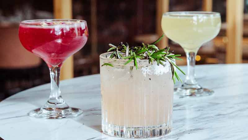 Three cocktails on a table