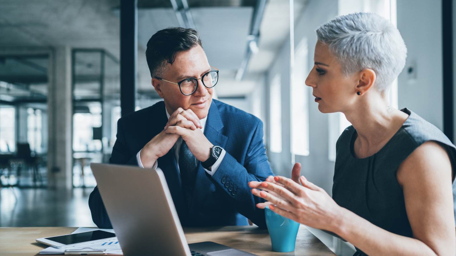 Woman in meeting with man