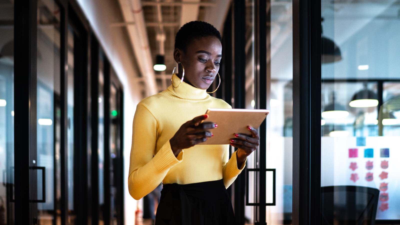 Woman looking at tablet in office