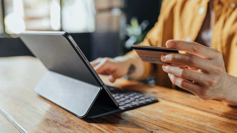 Person shopping online using a laptop